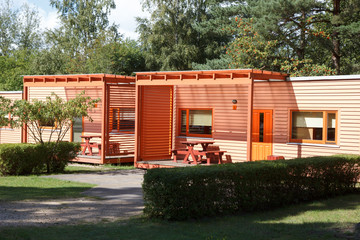 a camping cottages surrounded by green trees