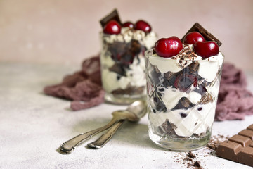 Layered dessert "Black forest" - chocolate biscuit,whipped cream, cherry and rum or brendy.