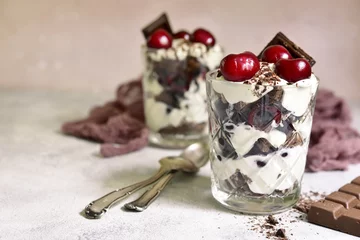 Rolgordijnen Layered dessert "Black forest" - chocolate biscuit,whipped cream, cherry and rum or brendy. © lilechka75