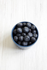Blueberries in a blue bowl, top view.