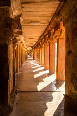 Beautiful view of hallway full of columns at an Indian ancient temple, Brihadeshwara temple, Thanjavur, Tamil Nadu, India