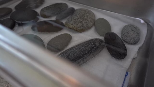 pan right, hot stone in water