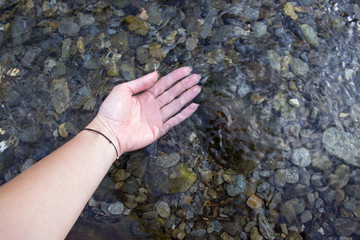 Woman hand in River