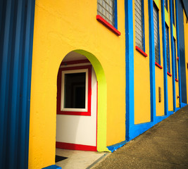Yellow wall with blue leading lines and red trim
