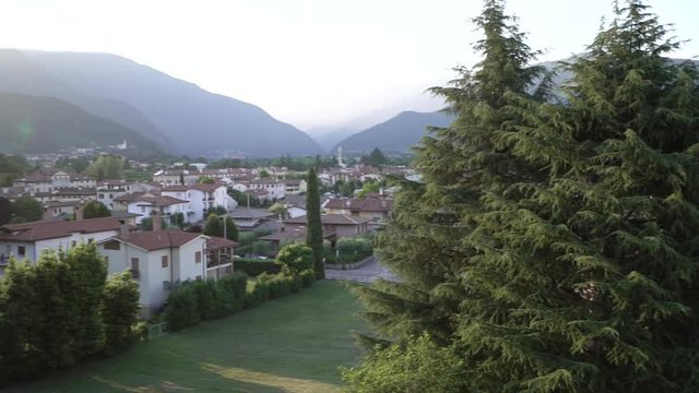 pan left, town in France with mountains in background