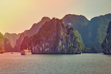 Halong bay boats,Sunset at Ha Long Bay scenic view , Hanoi, Vietnam
