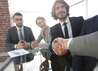 background image of handshake of business partners