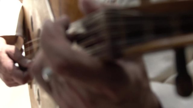 Person playing guitar, close up