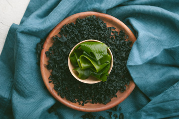 asian seaweed in wooden bowl. dried and wet variation