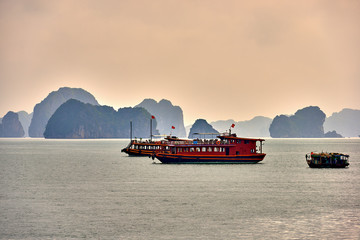 Halong bay boats,Sunset at Ha Long Bay scenic view , Hanoi, Vietnam