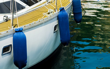 Fototapeta na wymiar buoy hanging outside the hull of the boat, boat equipment
