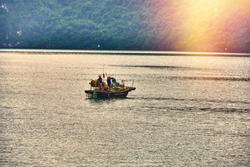 Halong bay boats,Sunset at Ha Long Bay scenic view , Hanoi, Vietnam