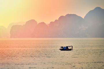 Halong bay boats,Sunset at Ha Long Bay scenic view , Hanoi, Vietnam