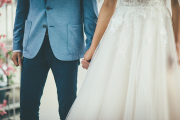 newlyweds walking holding hands