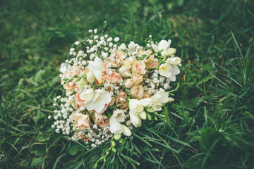 Obraz na płótnie Canvas wedding bouquet with roses and white beige flowers