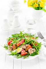 Salad with tuna. Vegetable salad with boiled egg, tuna and arugula. Fish salad