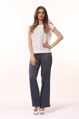young caucasian business woman executive posing in summer casual print blouse and jeans high heels...