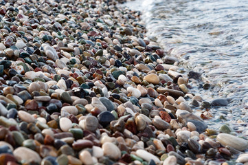 Sea pebbles on the shoreline, close-up