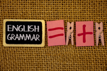 Writing note showing  English Grammar. Business photo showcasing Language Knowledge School Education Literature Reading Ideas on blackboard chalk letters equal plus signs cloth pins wicker.