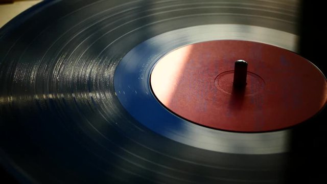The vinyl record is spinning on the turntable. Retro music. Clean sound of the plate. Soundtrack. Sound recording studio.