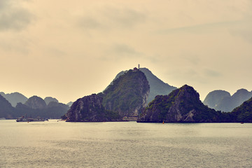 Halong bay boats, Vietnam Panoramic view of sunset in Halong Bay, Vietnam, Southeast Asia,UNESCO...
