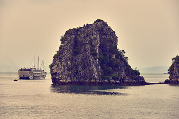 Halong bay boats, Vietnam Panoramic view of sunset in Halong Bay, Vietnam, Southeast Asia,UNESCO World Heritage Site, Poor lighting conditions