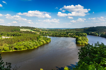 Fototapeta na wymiar Vltava river in deciduous forest, aerial view, summer day.