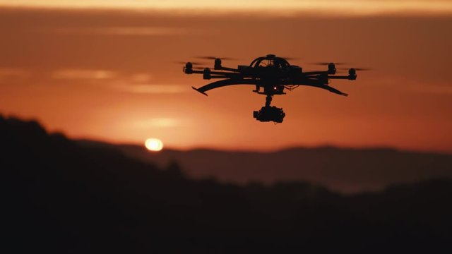 Close up professional drone octocopter filming sunset in New Zealand