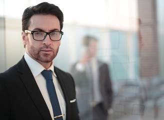 close up. serious businessman on the background of the office