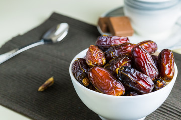 sweet dried dates fruit in small bowl