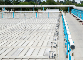 rows of metal panels with large pipes at a water treatment facility