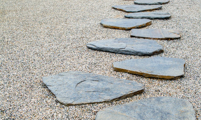 simple stone path in smooth gravel with copy space at a Japanese garden