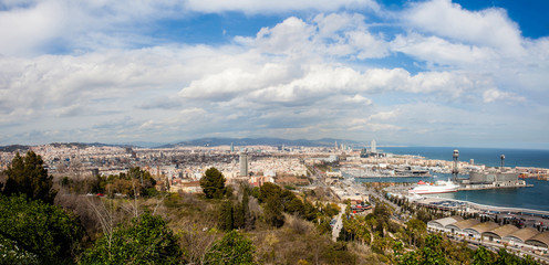 Fototapeta na wymiar Panorama of Barcelona harbour and city seen from Montjuic viewpoint
