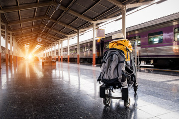 traveling luggage and passenger train at the train station, travel concept