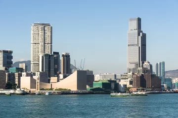 Foto op Canvas Kowloon skyline at Tsim Sha Tsui view from across the Victoria harbour in Hong Kong on a sunny day in China SAR. © jakartatravel
