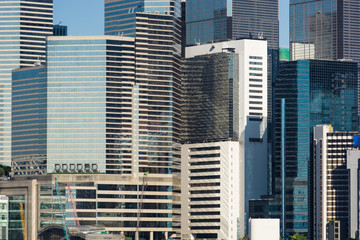 Naklejka premium Close up view of skyscrapers facade in the financial district of Hong Kong island in China.