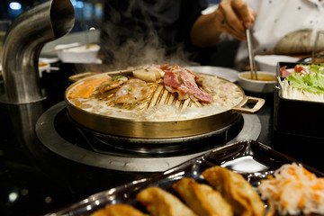 Pork grill on BBQ brass pan.