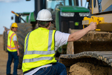climbing on excavator equipment