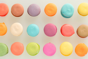Colorful french macarons on gray background.