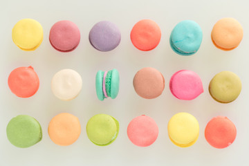 Fototapeta na wymiar Colorful french macarons on gray background.