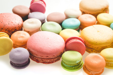 Fototapeta na wymiar Colorful french macarons on white background.