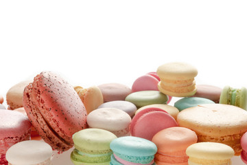 Colorful french macarons on white background.