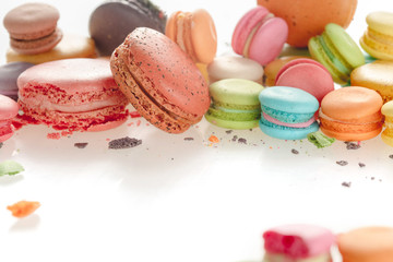 Colorful french macarons on white background.