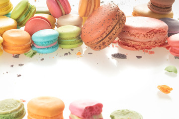 Colorful french macarons on white background.