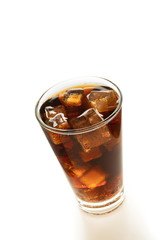 Cola in glass with ice on white background
