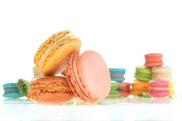 Colorful french macarons on white background.