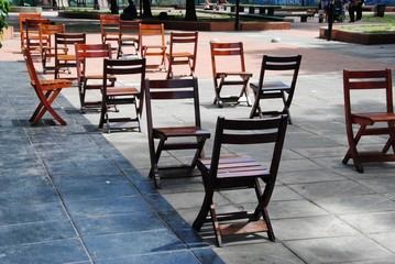 Fototapeta na wymiar Chairs at street