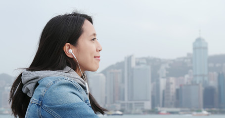 Fototapeta premium Woman listen to music on cellphone