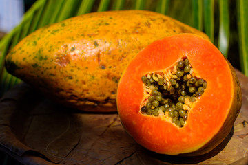 sliced papaya with grains