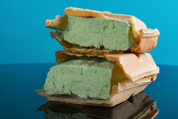 studio shoot of ice cream block on blue with reflection